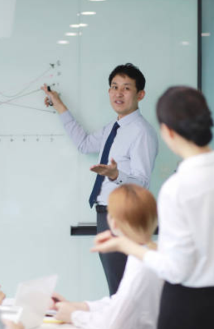 Man discuss diagram with two women